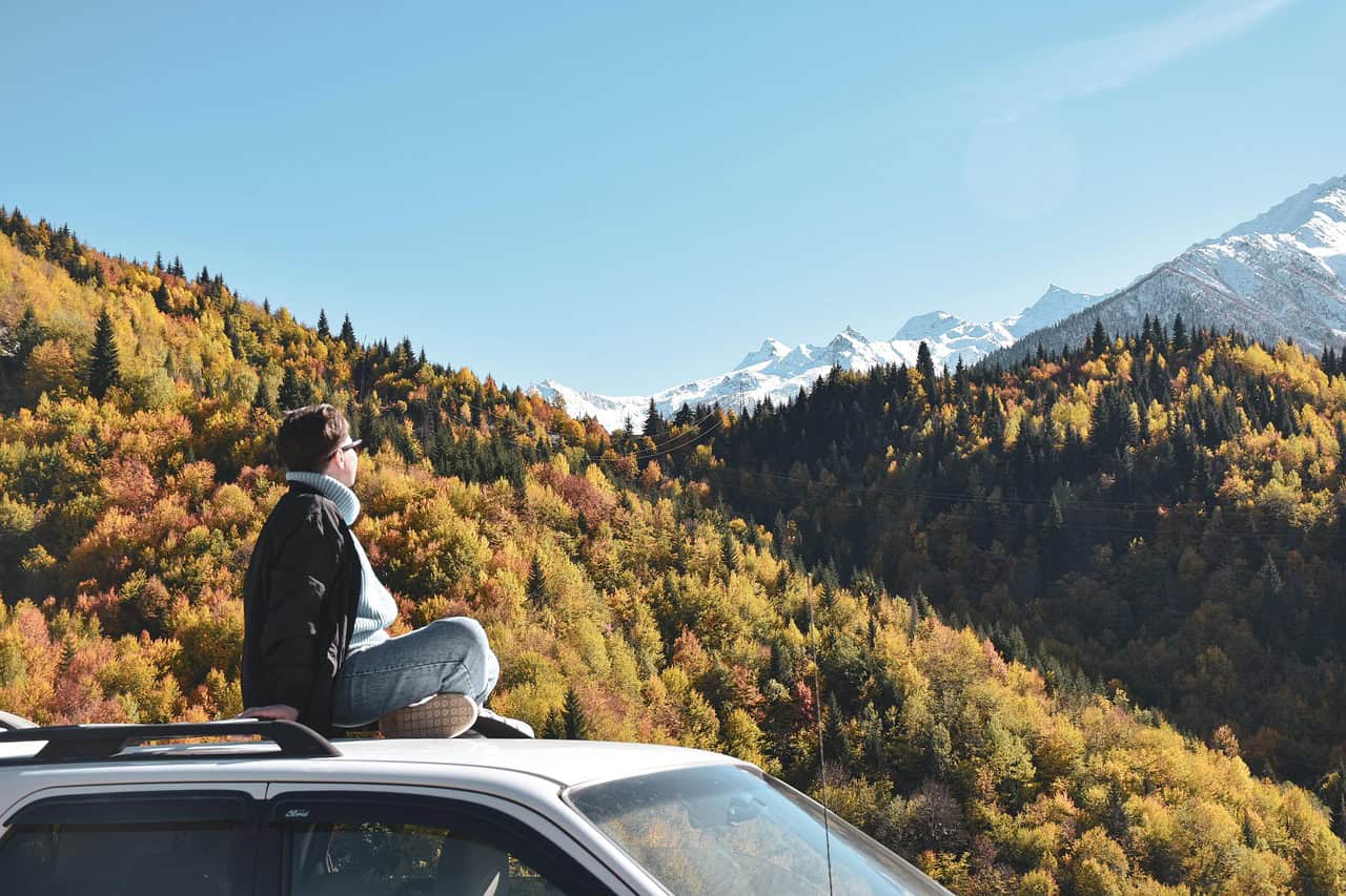 woman on the top of a car